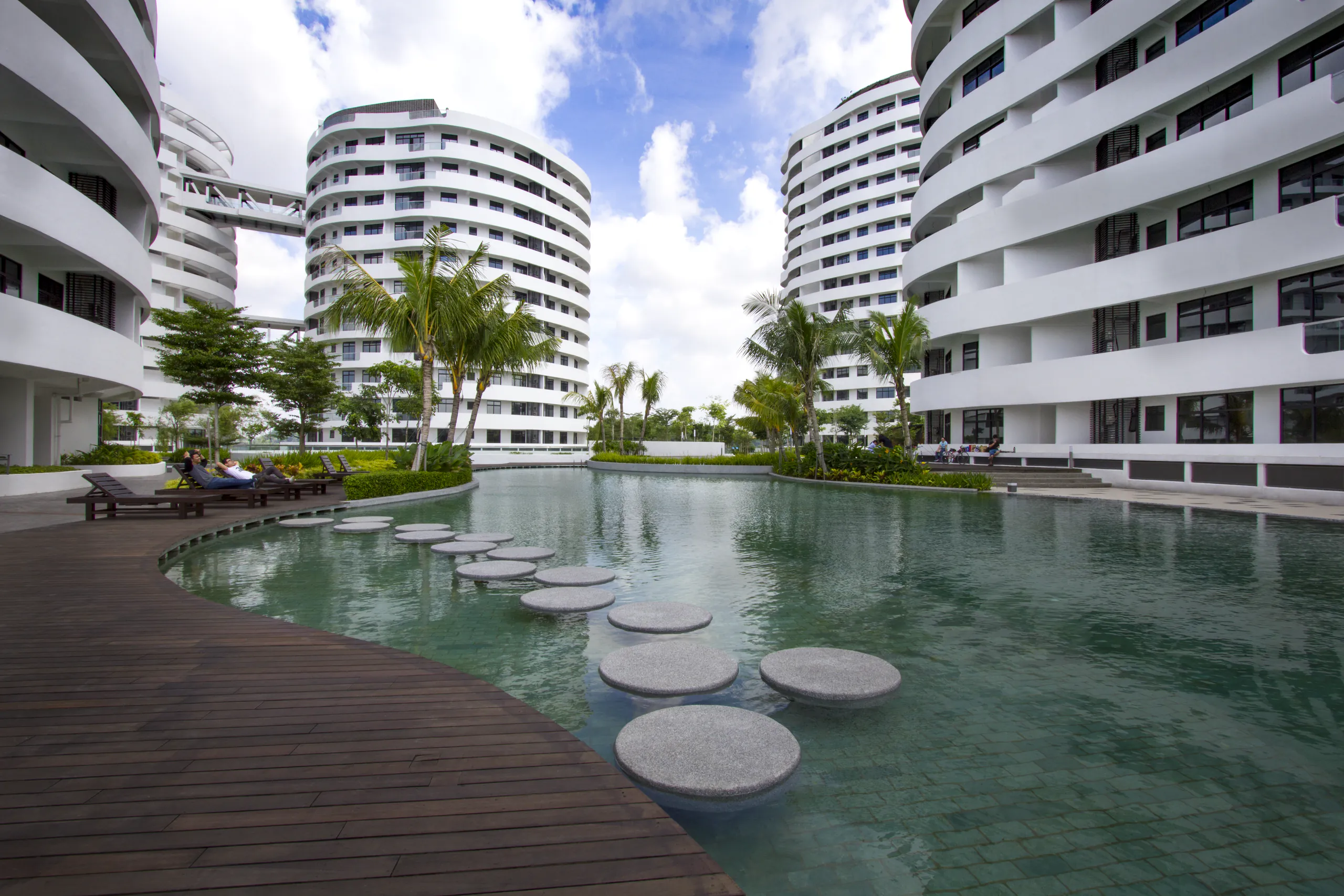 Pool with stepping stones and timber deck at O2 Residence